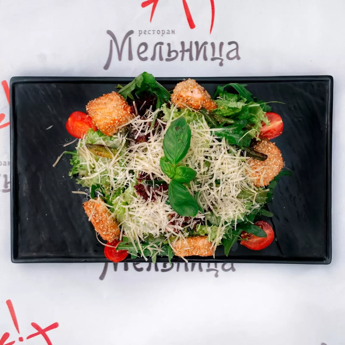 Warm salad with salmon in sesame • Melnitsa restaurant, Kharkiv